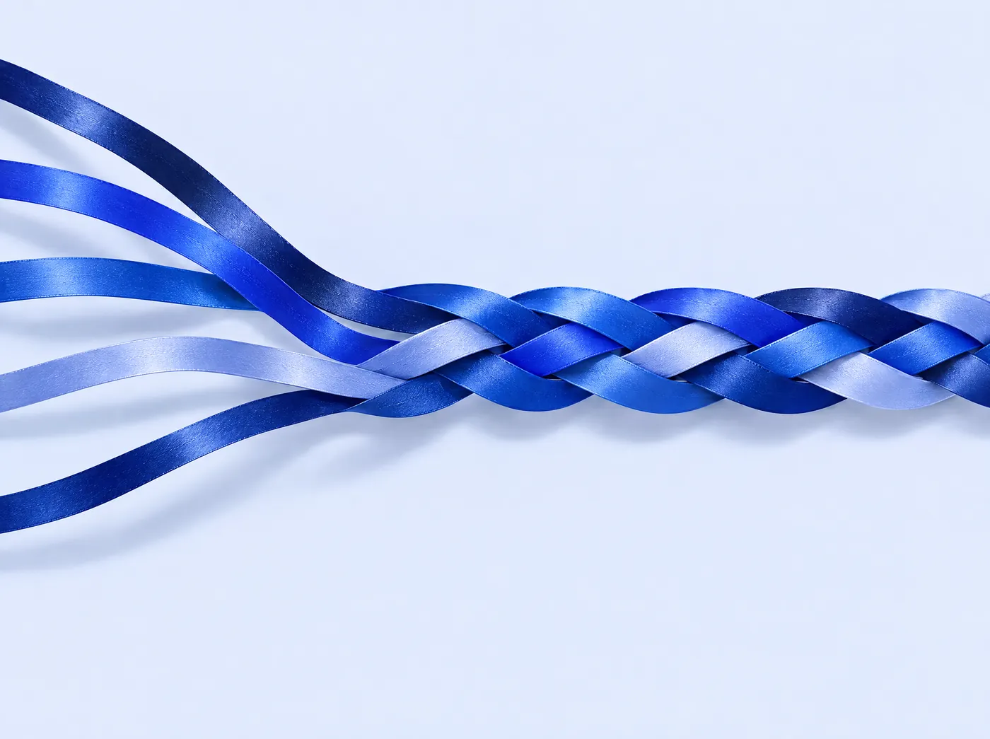 Five blue ribbons weaving into one braid.
