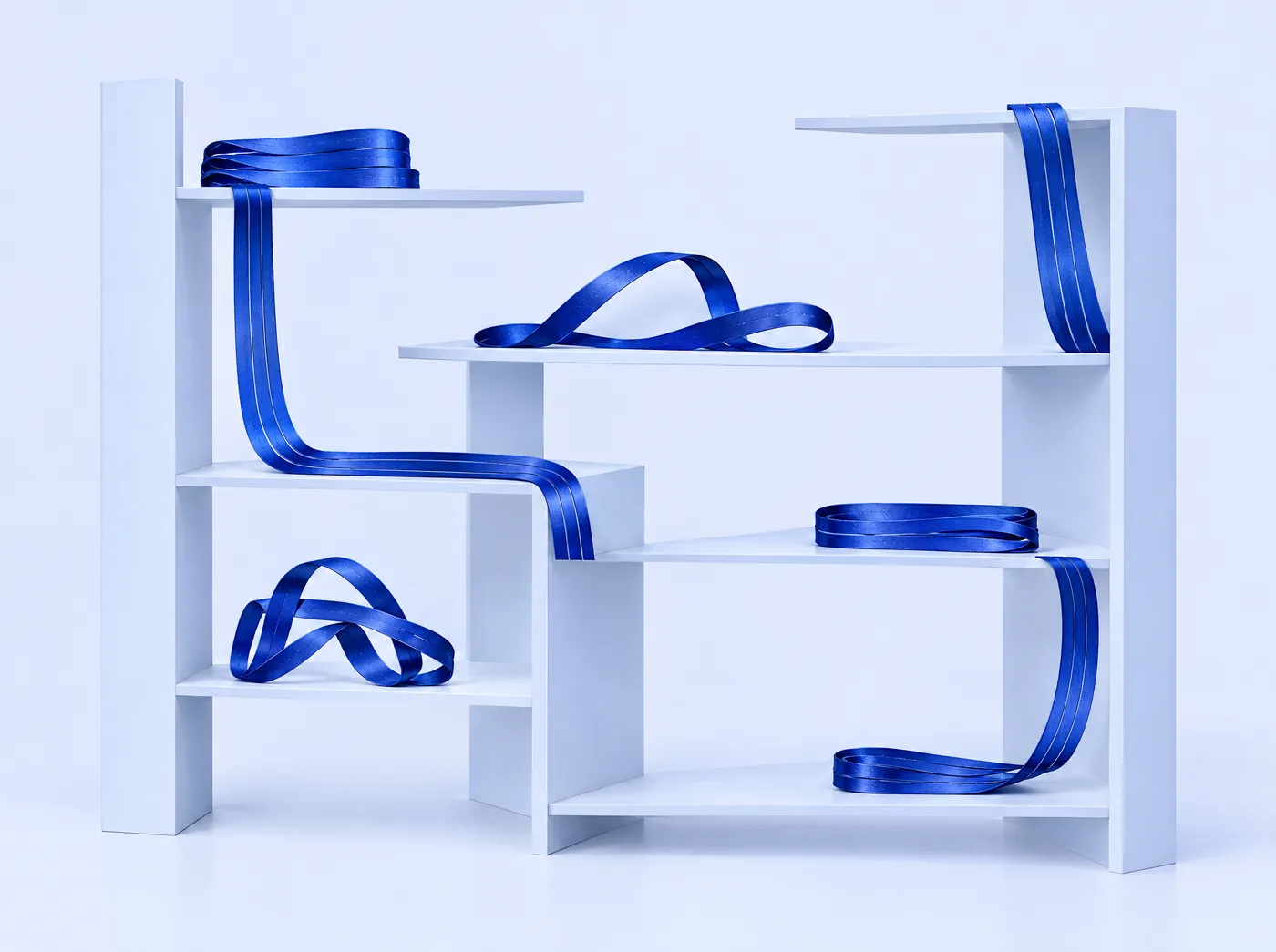 Cobalt ribbons laid neatly along open shelves.